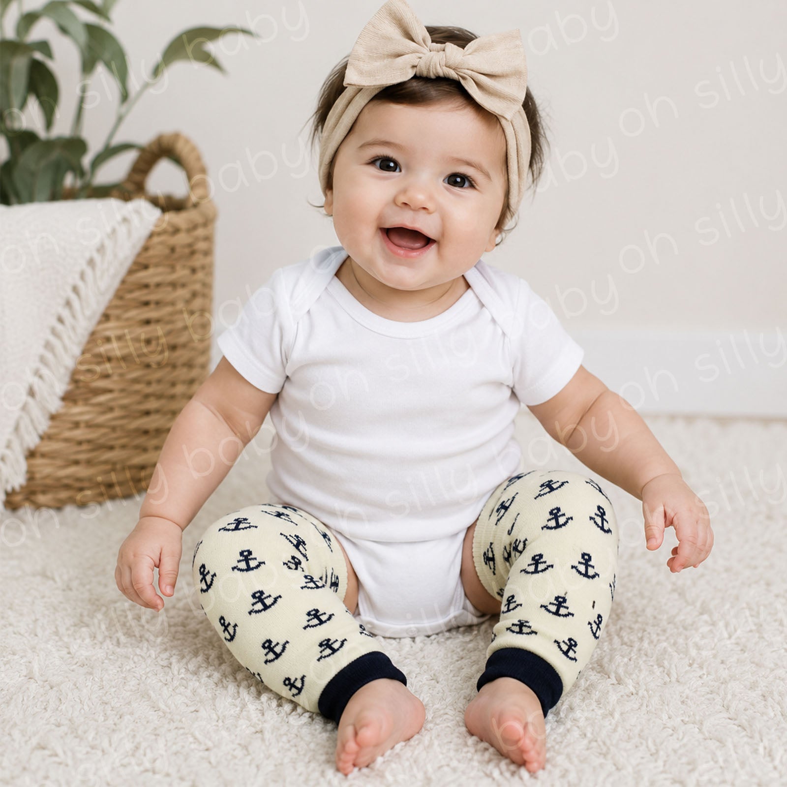 Baby wearing a white short sleeve bodysuit with Anchors Away baby leg warmers