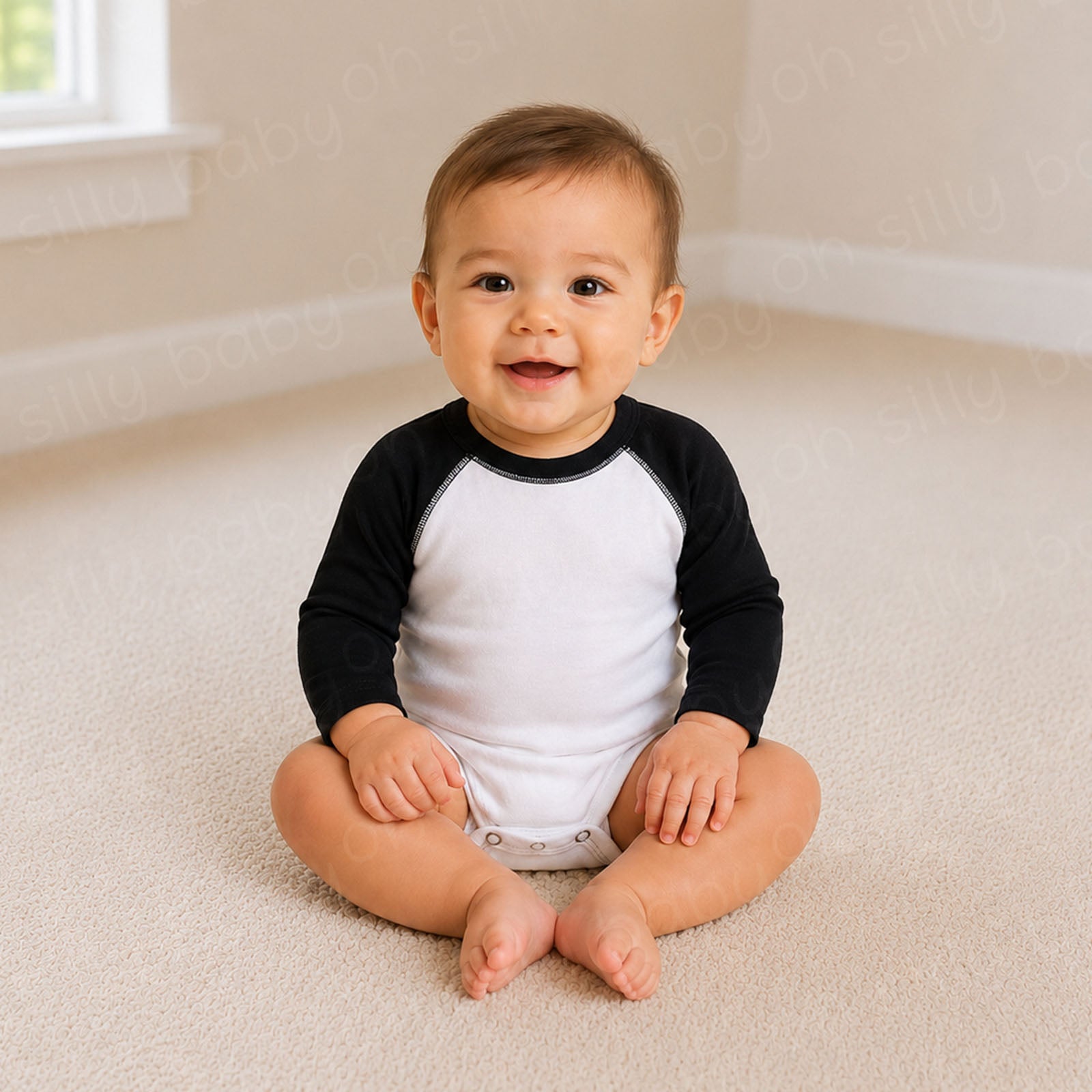 Baby wearing a black and white long sleeve raglan baby bodysuit
