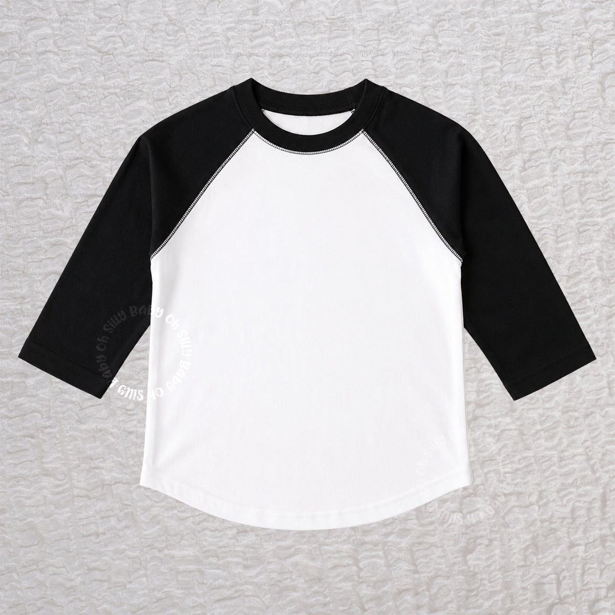 Black and white toddler raglan T-shirt with contrast 3/4-length sleeves made from 100% combed ringspun cotton fine jersey