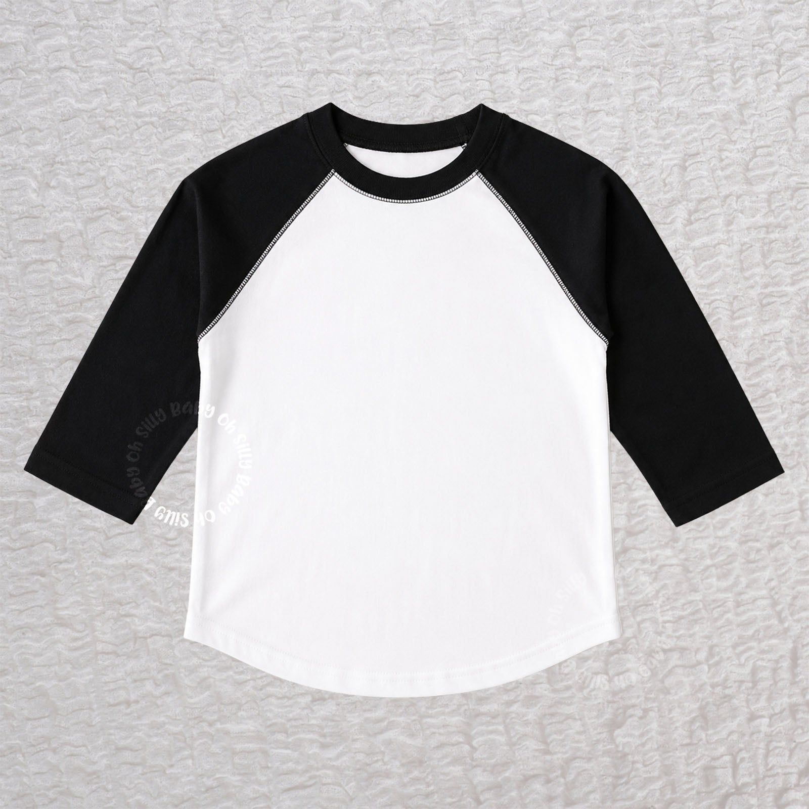 Black and white toddler raglan T-shirt with contrast 3/4-length sleeves made from 100% combed ringspun cotton fine jersey