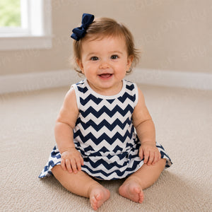 Baby girl wearing a blue and white chevron print grow with me dress