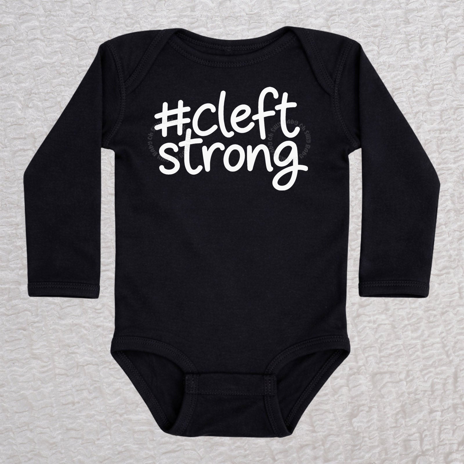Cleftstrong long sleeve baby bodysuit in black with white #cleftstrong design