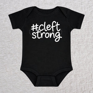 Cleftstrong short sleeve baby bodysuit in black with white #cleftstrong design