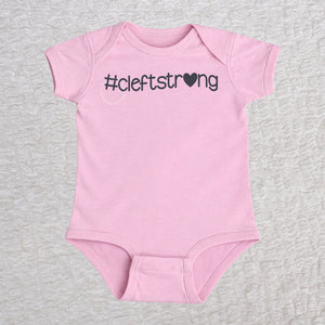 Cleftstrong Heart short sleeve baby bodysuit in pink featuring a pink Cleftstrong heart design