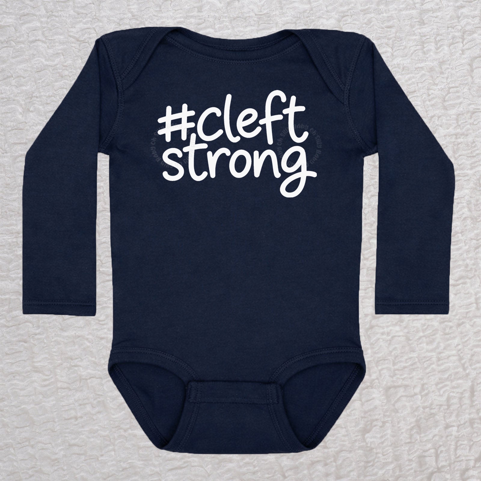 Cleftstrong long sleeve baby bodysuit in navy with white #cleftstrong design
