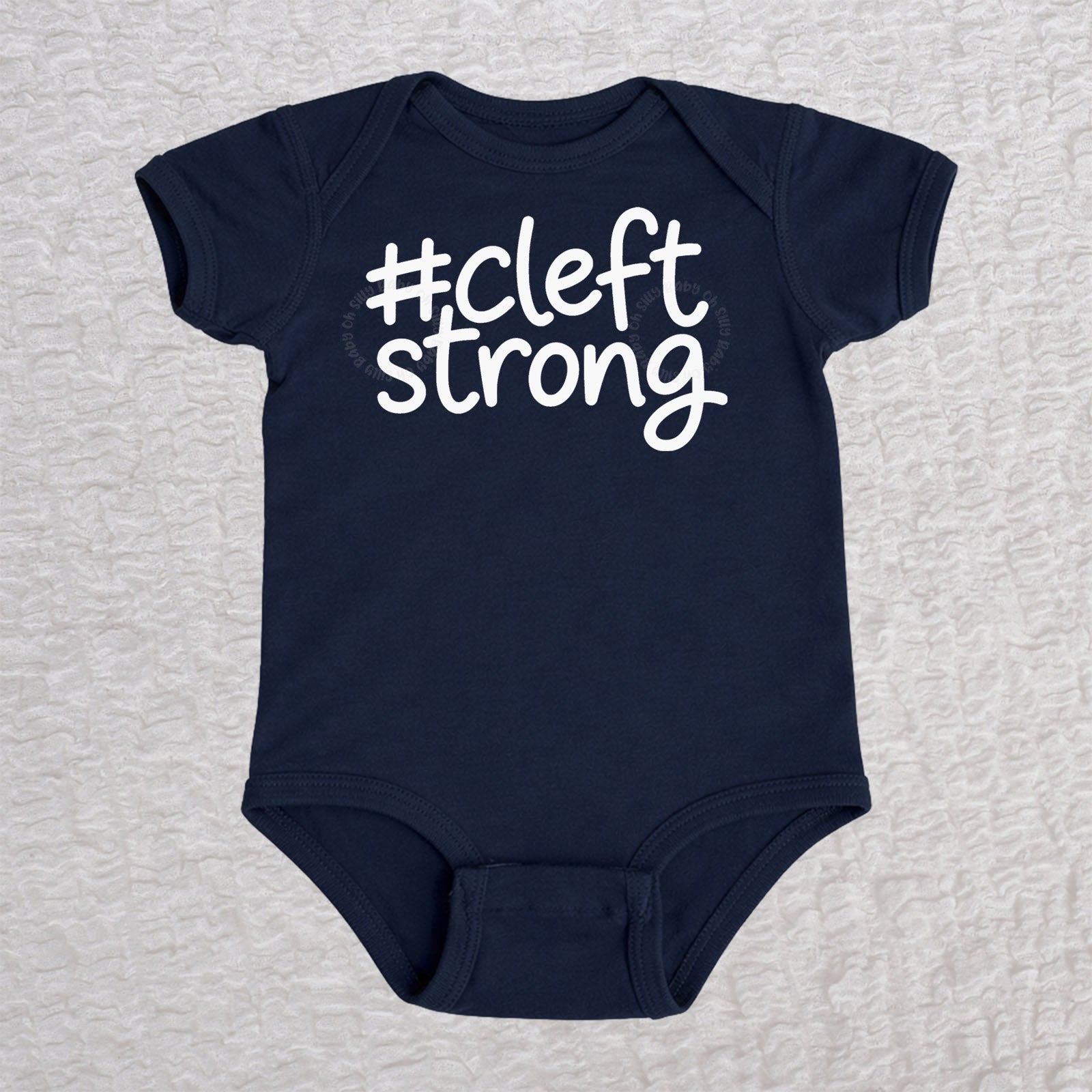 Cleftstrong short sleeve baby bodysuit in navy with white #cleftstrong design