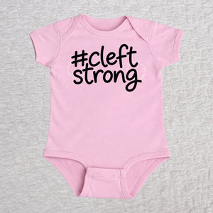 Cleftstrong short sleeve baby bodysuit in pink with black #cleftstrong design