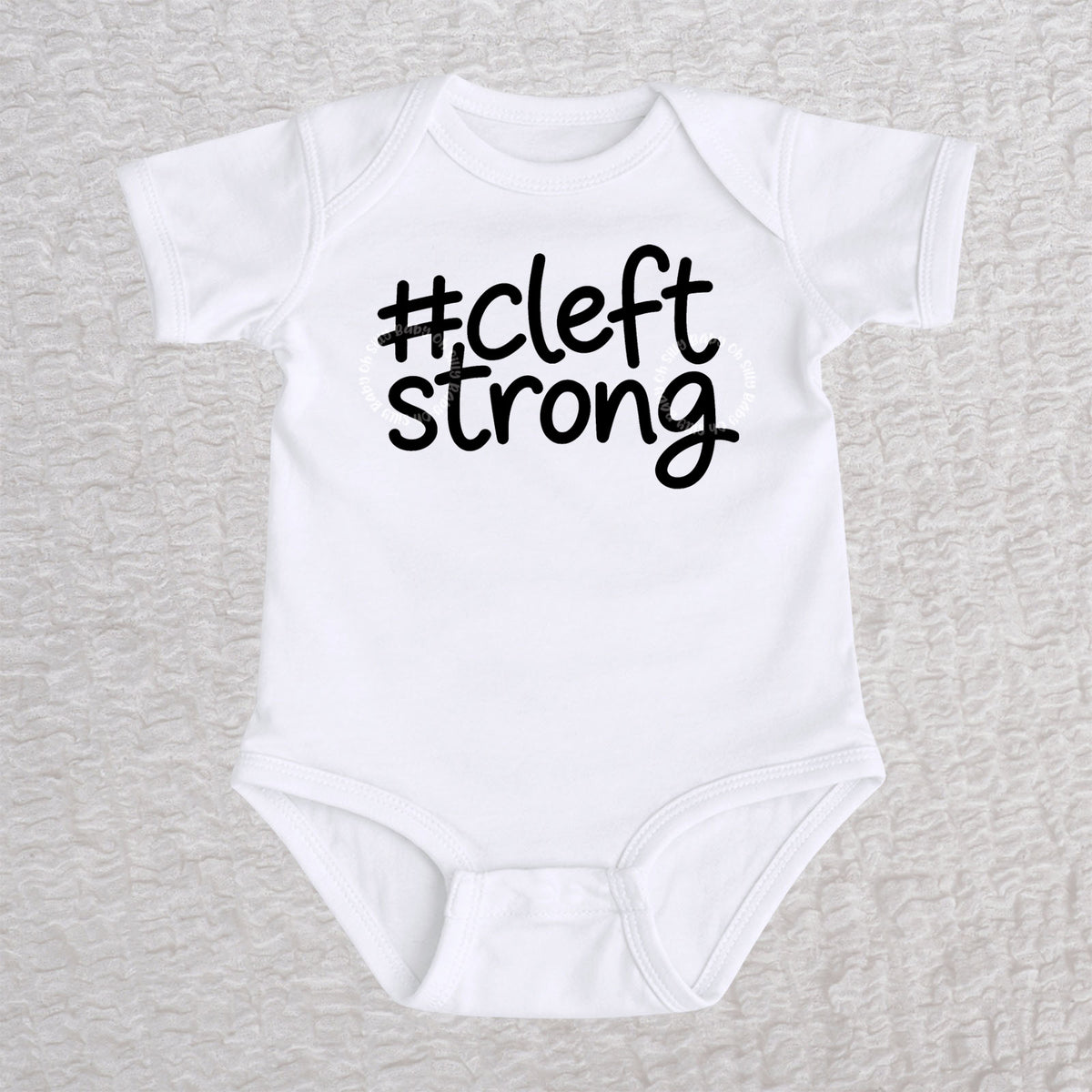 Cleftstrong short sleeve baby bodysuit in white with black #cleftstrong design