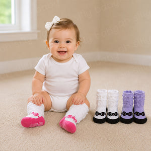 Baby girl wearing pink Emma Socks with black and lavender Emma Sock color options displayed beside her