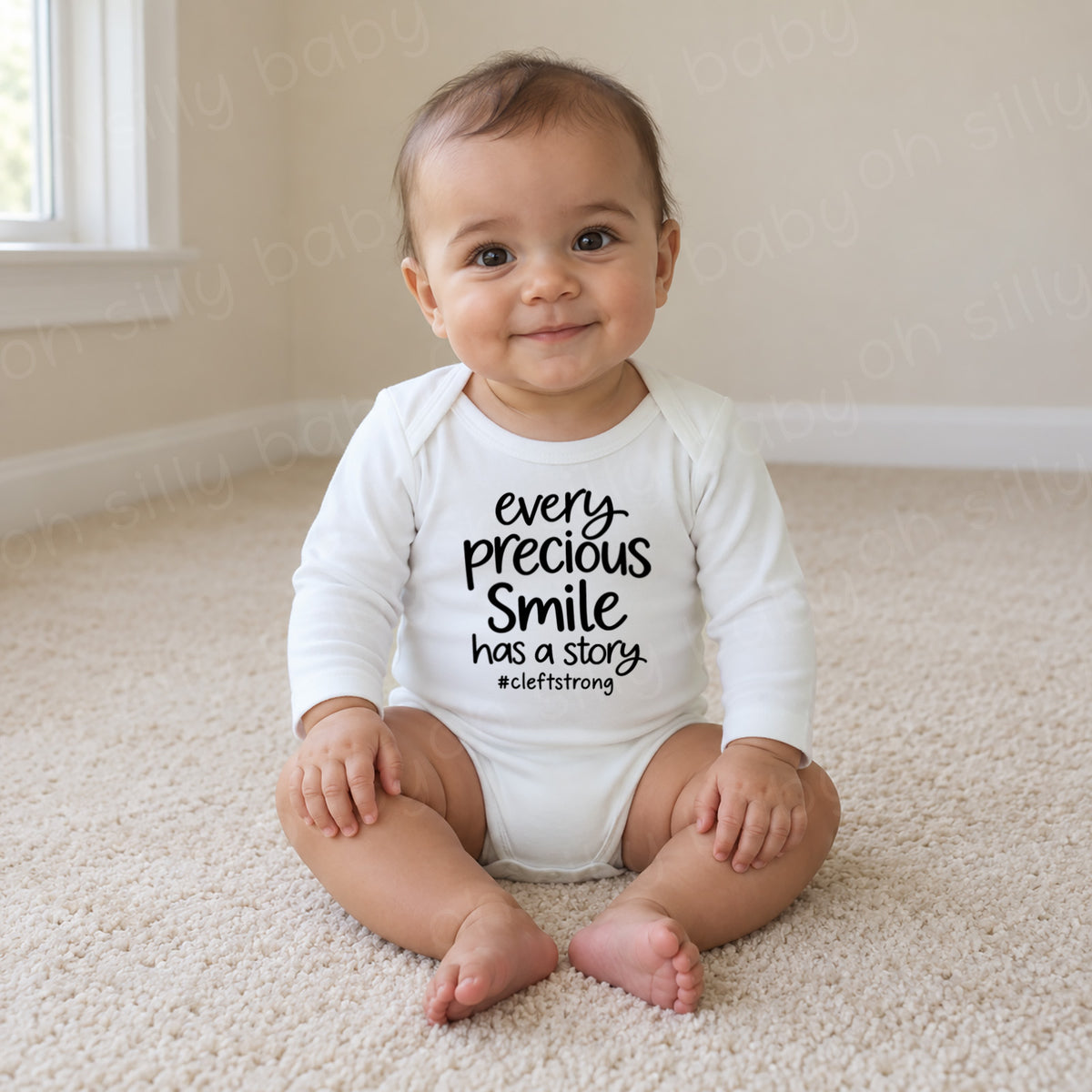 Every Precious Smile Has A Story baby wearing white long sleeve bodysuit with black #cleftstrong design