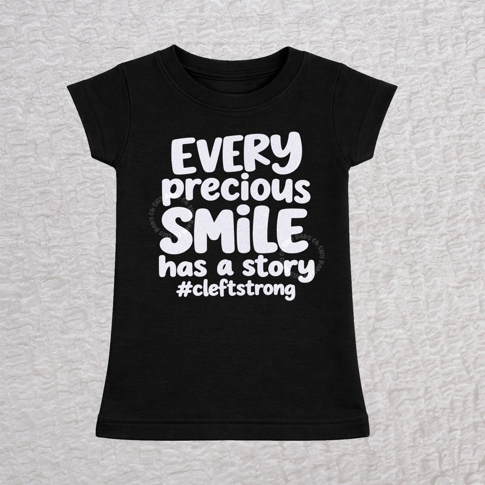 Every Precious Smile Has A Story toddler girls fit T-shirt in black with rainbow white glitter #cleftstrong design
