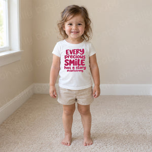 Every Precious Smile Has A Story toddler girl wearing white girls fit T-shirt with hot pink glitter #cleftstrong design