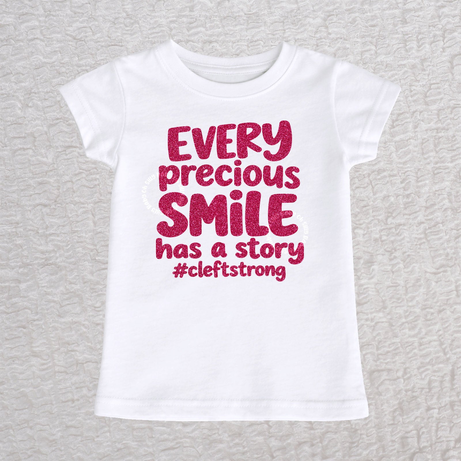 Every Precious Smile Has A Story toddler girls fit T-shirt in white with hot pink glitter #cleftstrong design