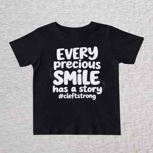 Every Precious Smile Has A Story unisex baby and toddler T-shirt in black with rainbow white glitter #cleftstrong design