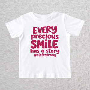 Every Precious Smile Has A Story unisex baby and toddler T-shirt in white with hot pink glitter #cleftstrong design