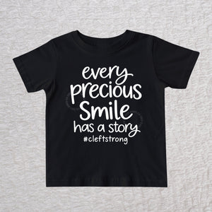 Every Precious Smile Has A Story unisex baby and toddler T-shirt in black with white #cleftstrong design