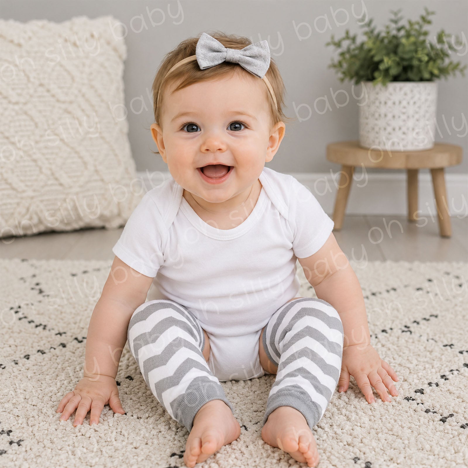 Baby wearing a white short sleeve bodysuit with Gray and White Chevron baby leg warmers