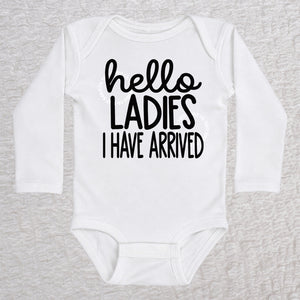 Hello Ladies I Have Arrived long sleeve baby bodysuit in white with playful typography design