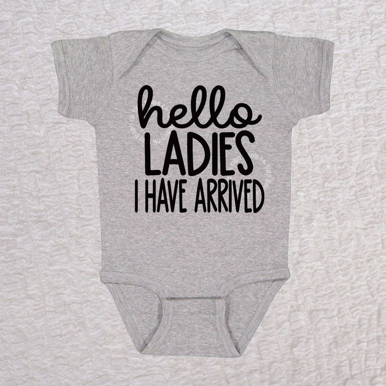 Hello Ladies I Have Arrived baby bodysuit in heather with playful typography design