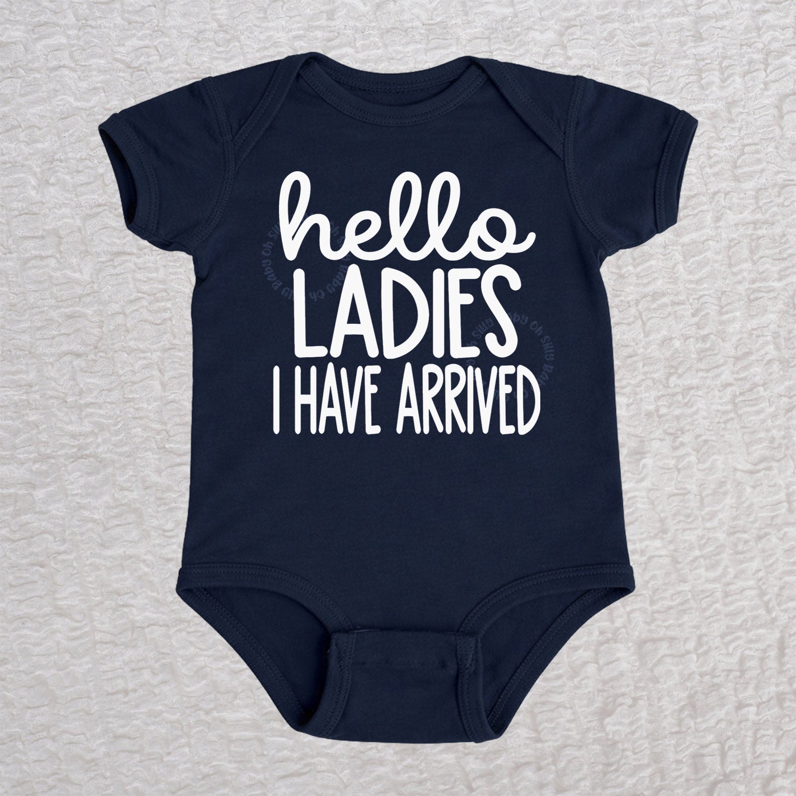 Hello Ladies I Have Arrived baby bodysuit in navy with playful typography design