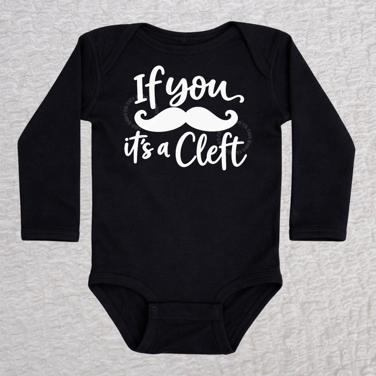 If You Mustache It's A Cleft long sleeve baby bodysuit in black with mustache design