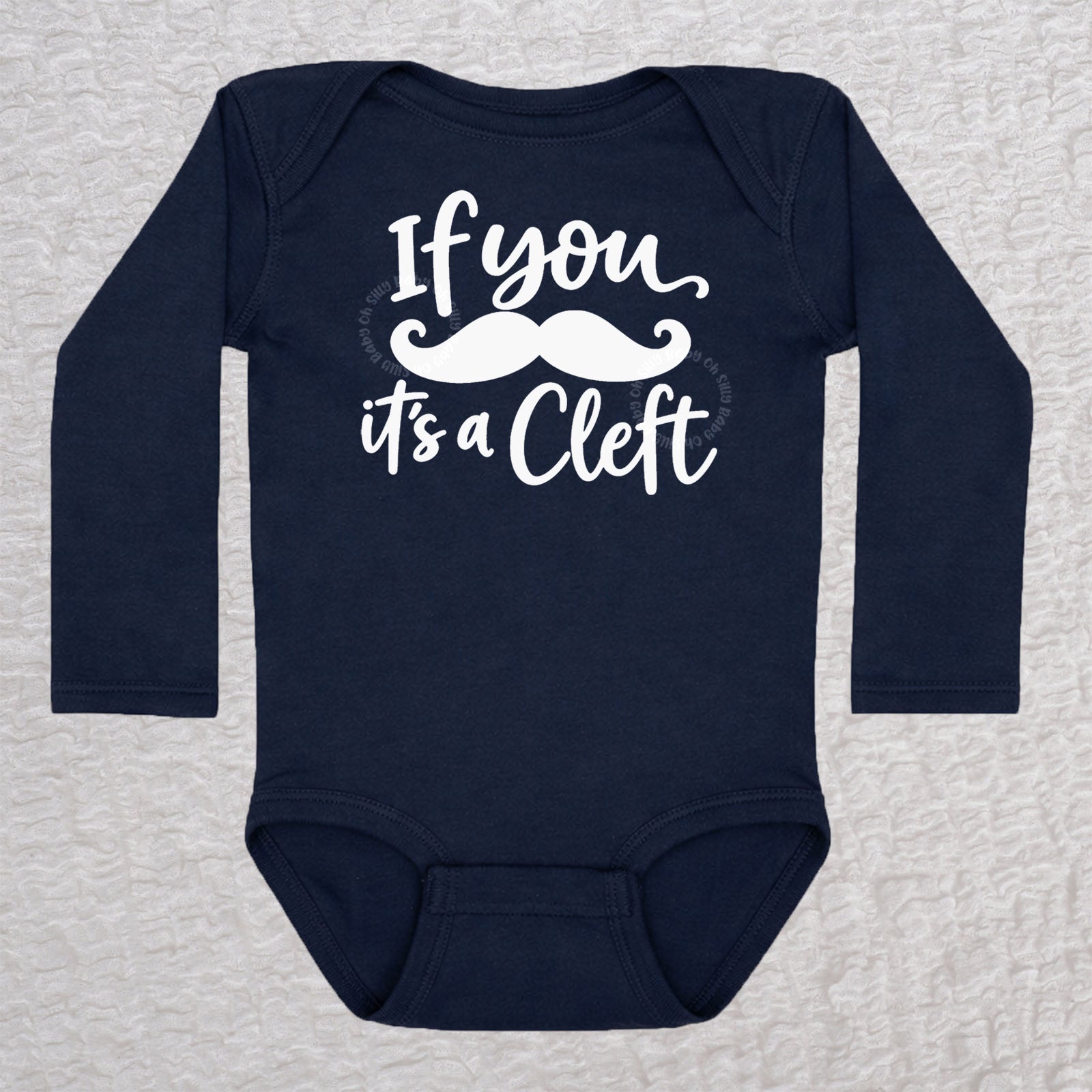 If You Mustache It's A Cleft long sleeve baby bodysuit in navy with mustache design