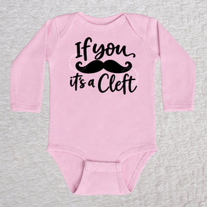 If You Mustache It's A Cleft long sleeve baby bodysuit in pink with black mustache design