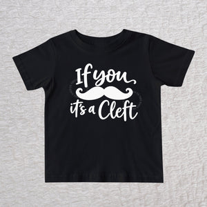 If You Mustache It's A Cleft unisex baby and toddler T-shirt in black with white mustache design