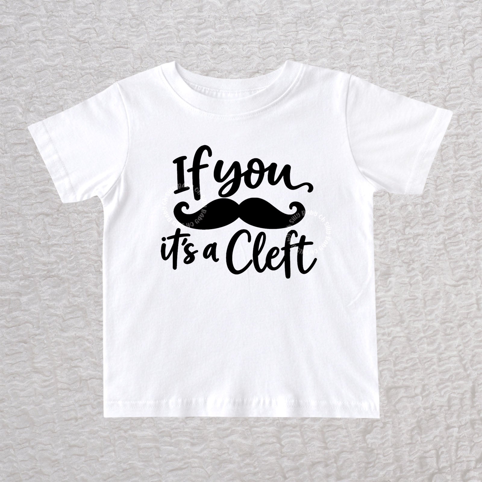 If You Mustache It's A Cleft unisex baby and toddler T-shirt in white with black mustache design
