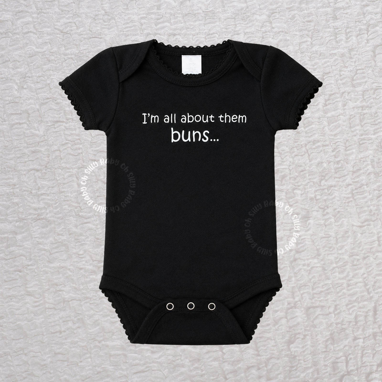 Black baby bodysuit with the funny saying I'm All About Them Buns on the front