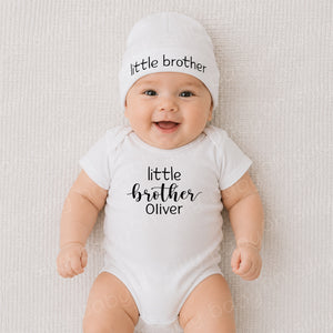 Baby wearing personalized Little Brother beanie hat and matching baby bodysuit with custom name