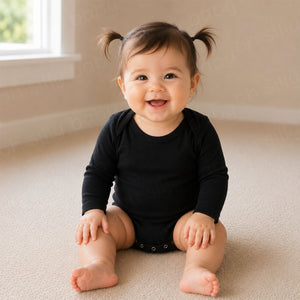 Baby girl wearing a plain black long sleeve baby bodysuit