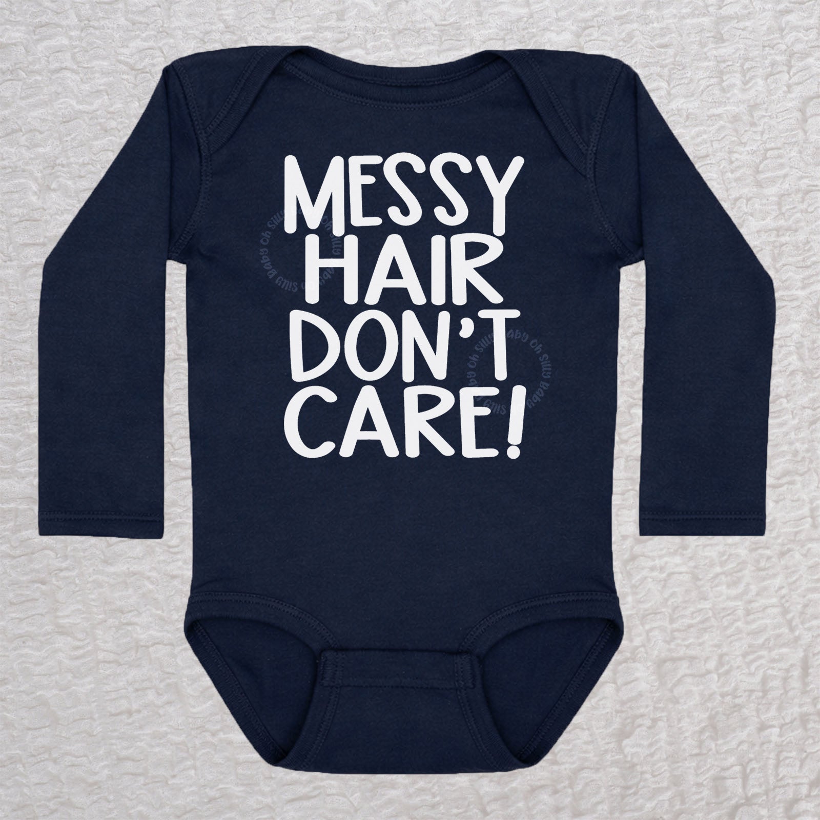 Messy Hair Don't Care long sleeve baby bodysuit in navy with playful typography design