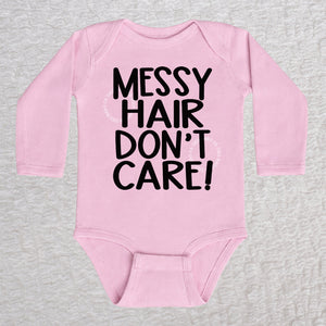 Messy Hair Don't Care long sleeve baby bodysuit in pink with playful typography design
