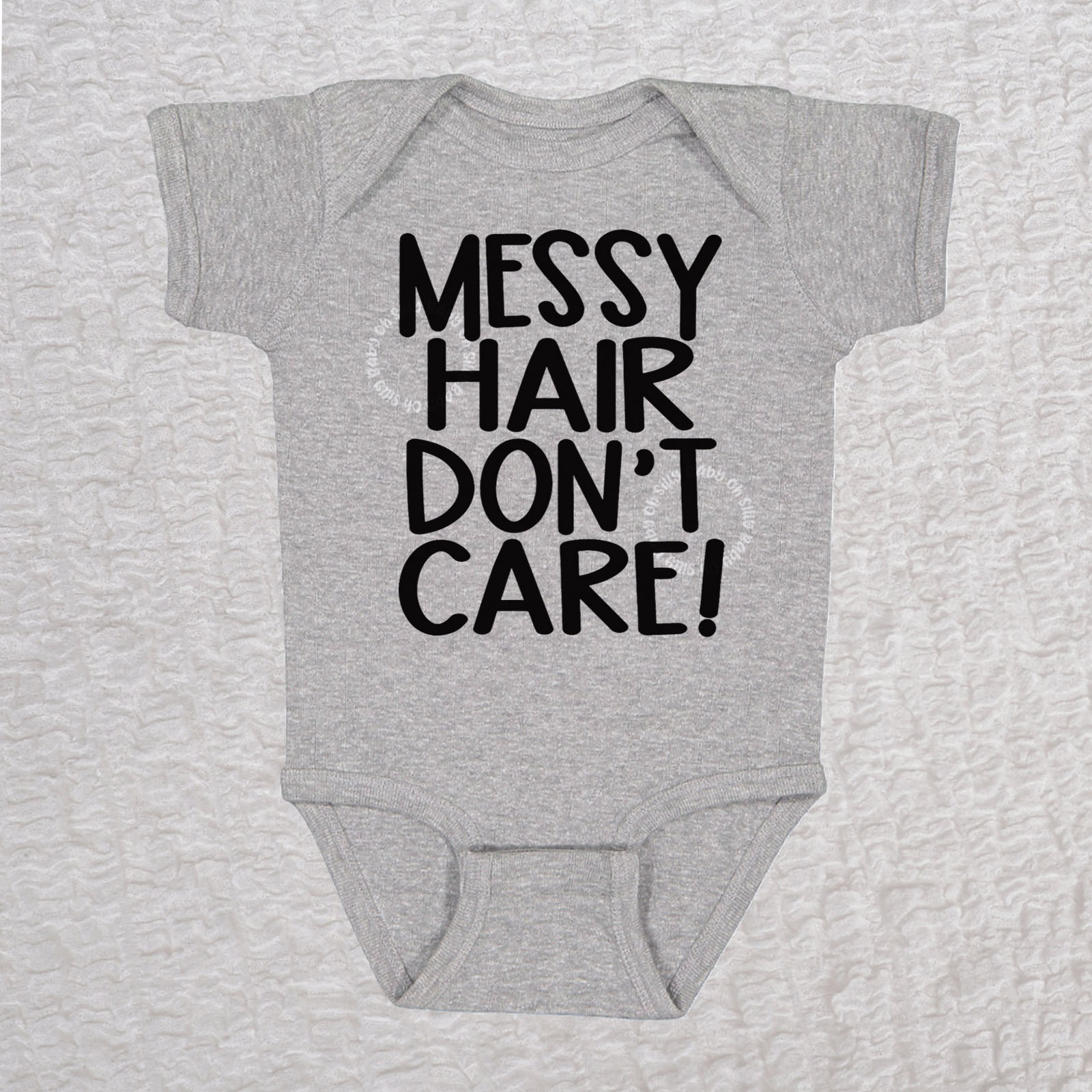 Messy Hair Don't Care short sleeve baby bodysuit in heather with playful typography design