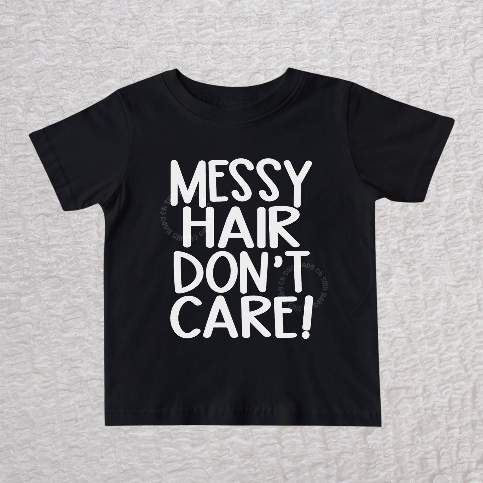 Messy Hair Don't Care unisex baby and toddler t-shirt in black with playful typography design