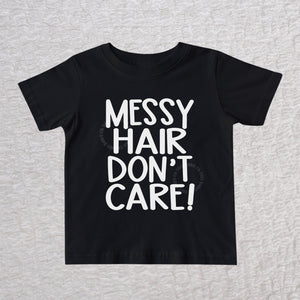 Messy Hair Don't Care unisex baby and toddler t-shirt in black with playful typography design