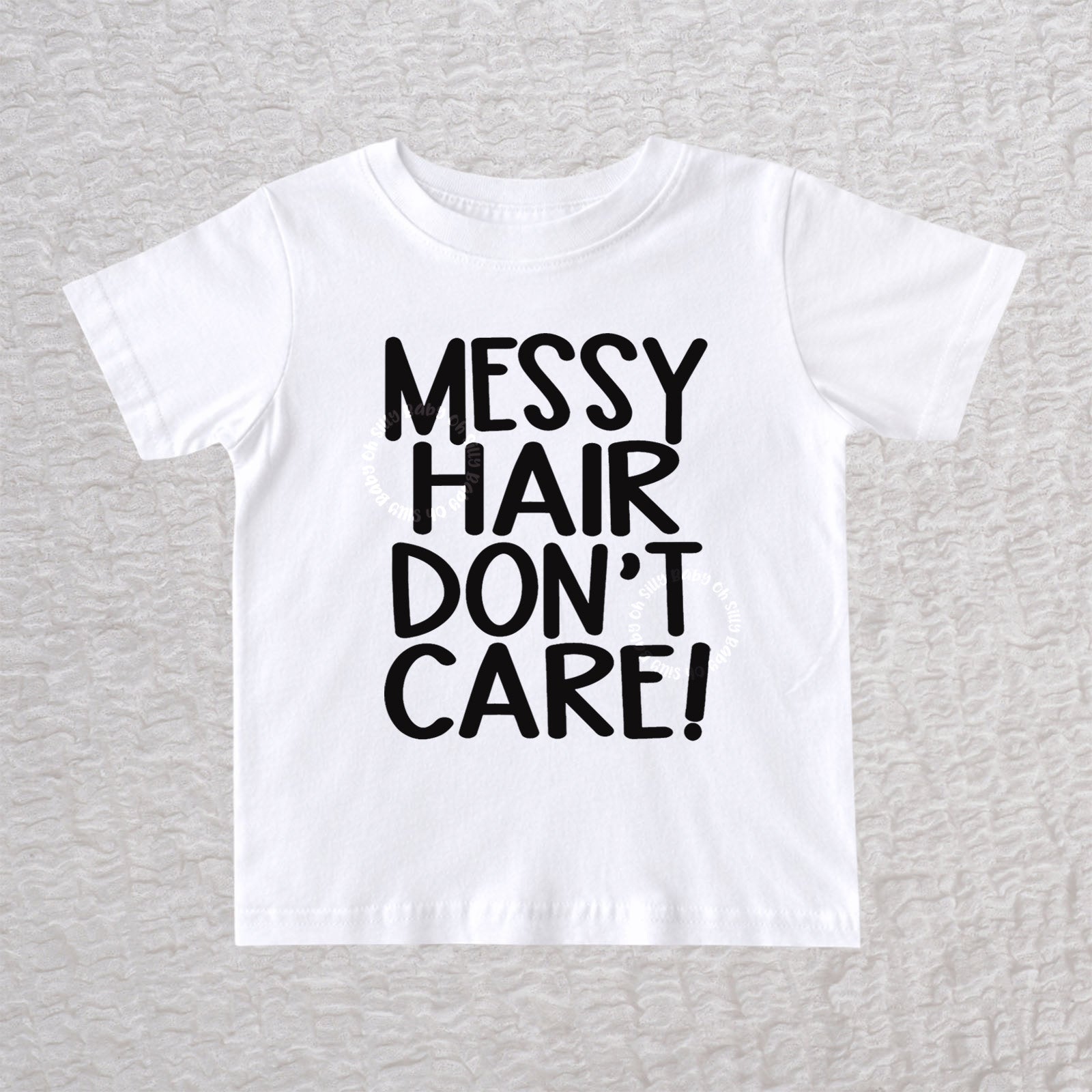Messy Hair Don't Care unisex baby and toddler t-shirt in white with playful typography design