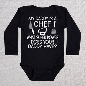 My Daddy Is a Chef long sleeve baby bodysuit in black with chef hat, knife and spatula design