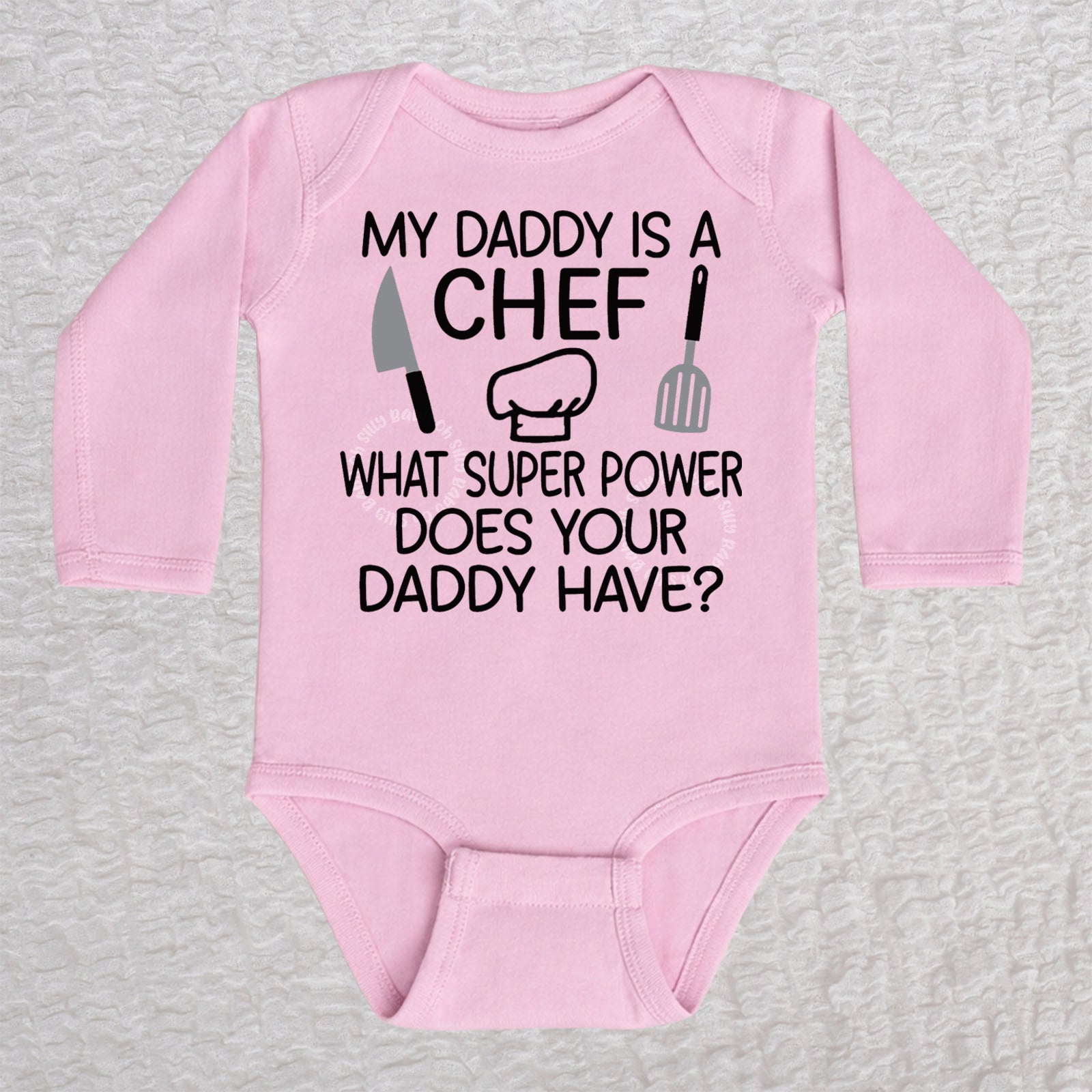 My Daddy Is a Chef long sleeve baby bodysuit in pink with chef hat, knife and spatula design