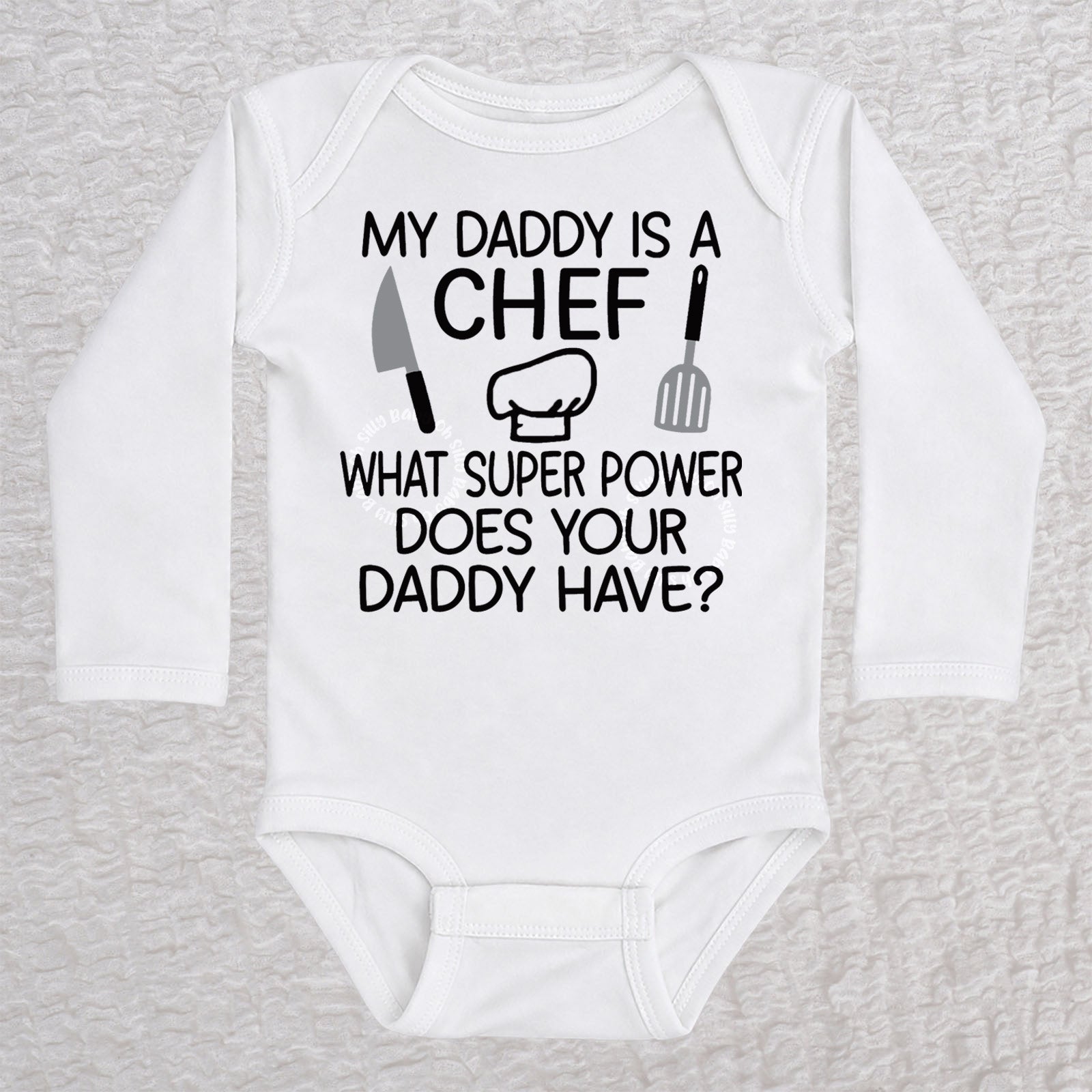My Daddy Is a Chef long sleeve baby bodysuit in white with chef hat, knife and spatula design