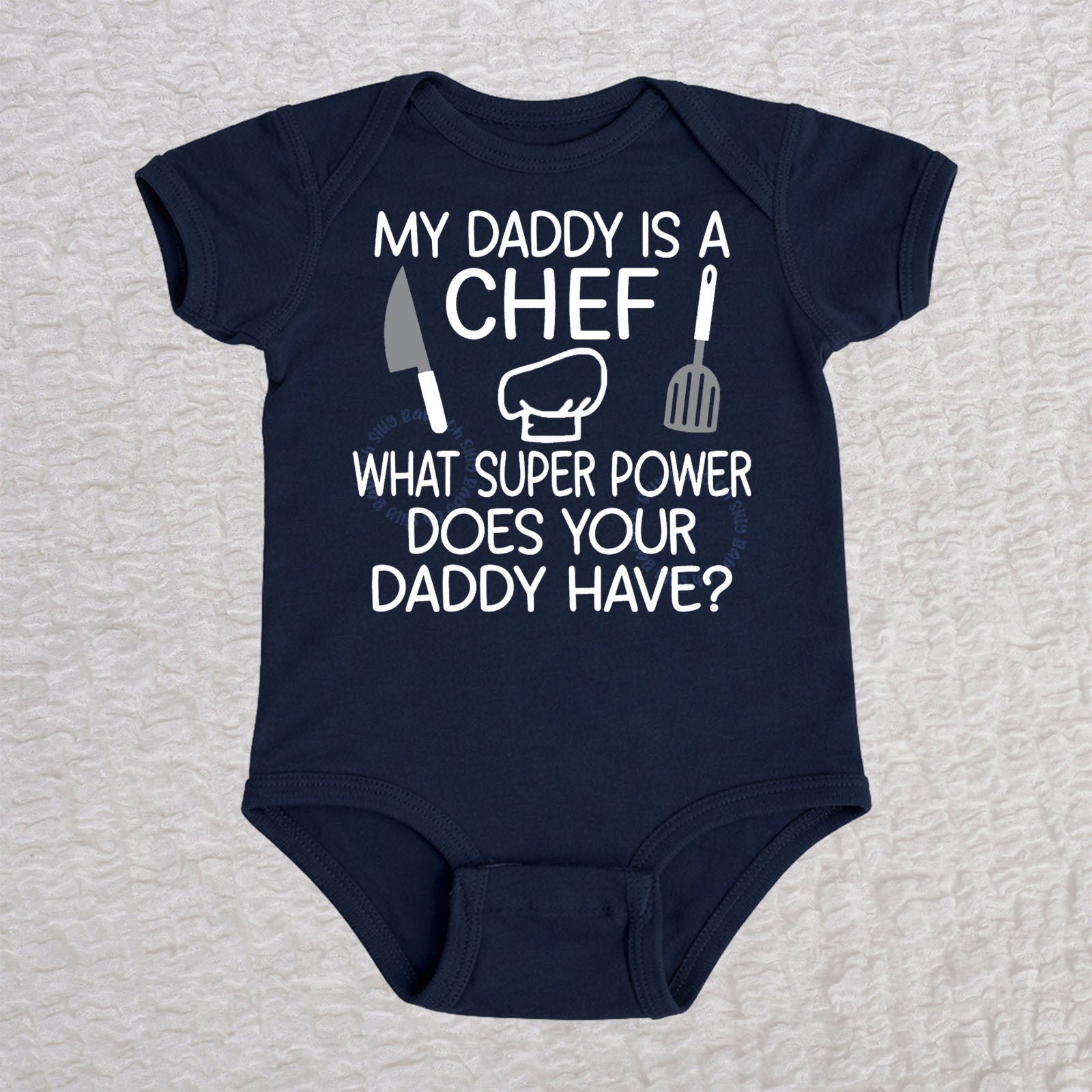My Daddy Is a Chef short sleeve baby bodysuit in navy with chef hat, knife and spatula design