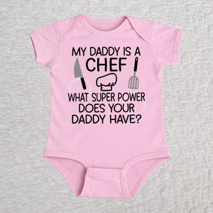 My Daddy Is a Chef short sleeve baby bodysuit in pink with chef hat, knife and spatula design