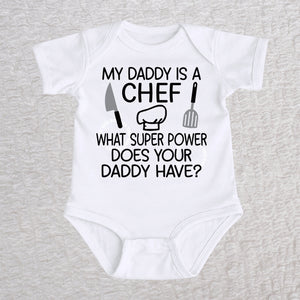 My Daddy Is a Chef short sleeve baby bodysuit in white with chef hat, knife and spatula design