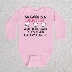 My Daddy Is a Dentist long sleeve baby bodysuit in pink featuring a tooth design