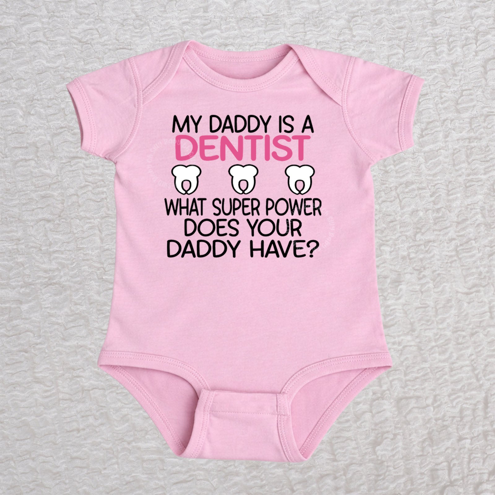 My Daddy Is a Dentist short sleeve baby bodysuit in pink featuring a tooth design