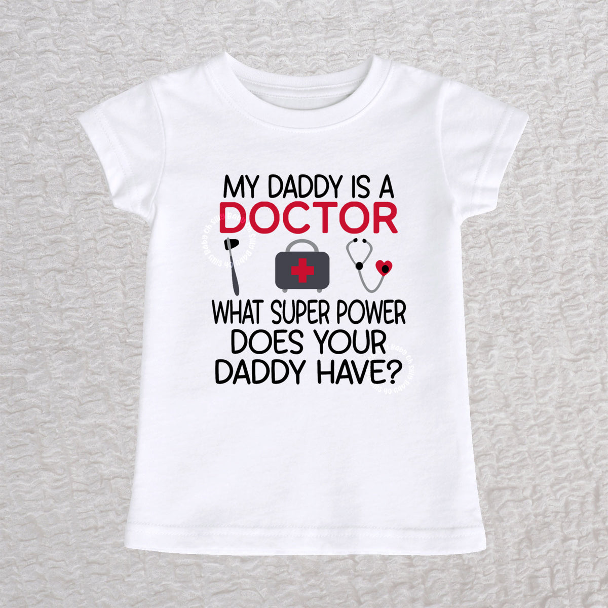 My Daddy Is a Doctor girls fit baby and toddler t-shirt in white featuring a reflex hammer, doctor's bag, and stethoscope design