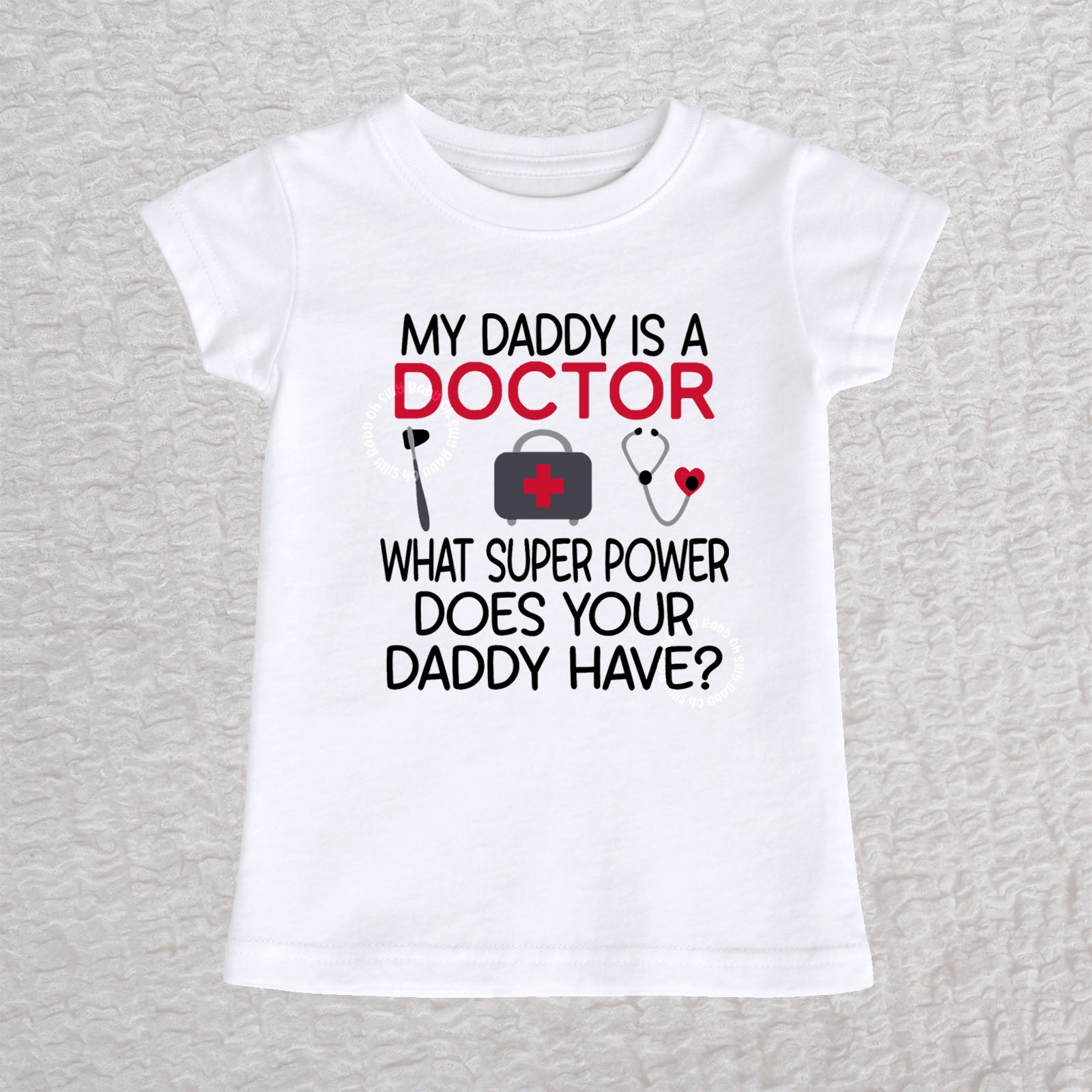 My Daddy Is a Doctor girls fit baby and toddler t-shirt in white featuring a reflex hammer, doctor's bag, and stethoscope design