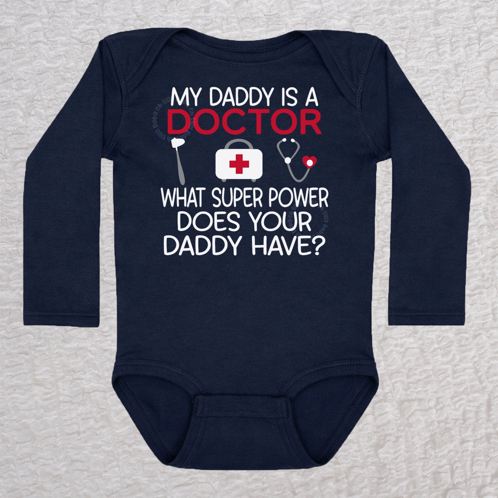 My Daddy Is a Doctor long sleeve baby bodysuit in navy featuring a reflex hammer, doctor's bag, and stethoscope design