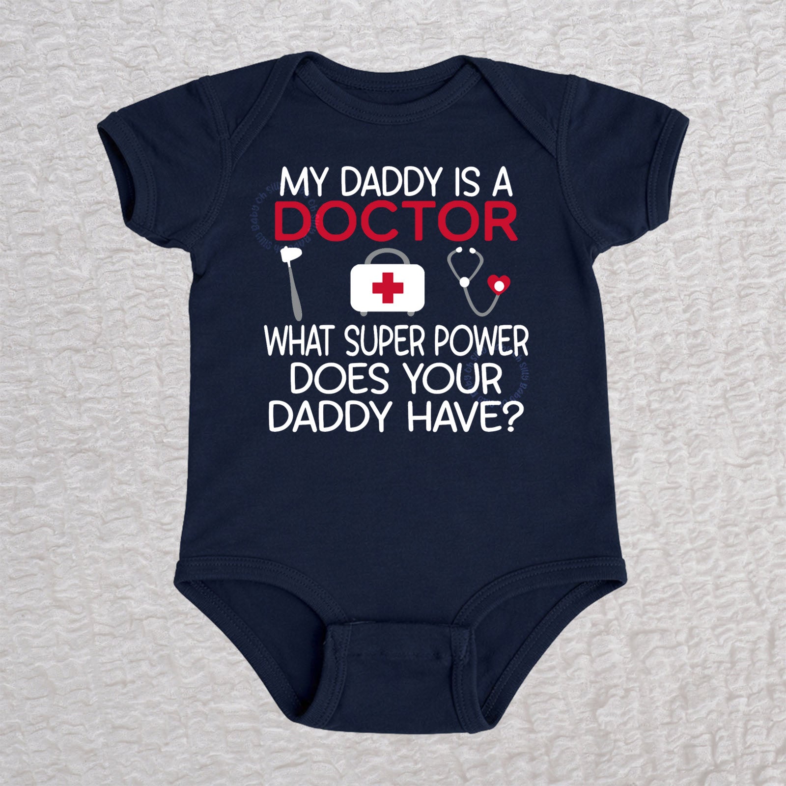 My Daddy Is a Doctor short sleeve baby bodysuit in navy featuring a reflex hammer, doctor's bag, and stethoscope design